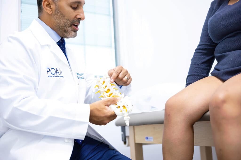 Dr. Nazarian - Princeton Orthopaedic Associates A POA spine specialist talks with a patient in the exam room