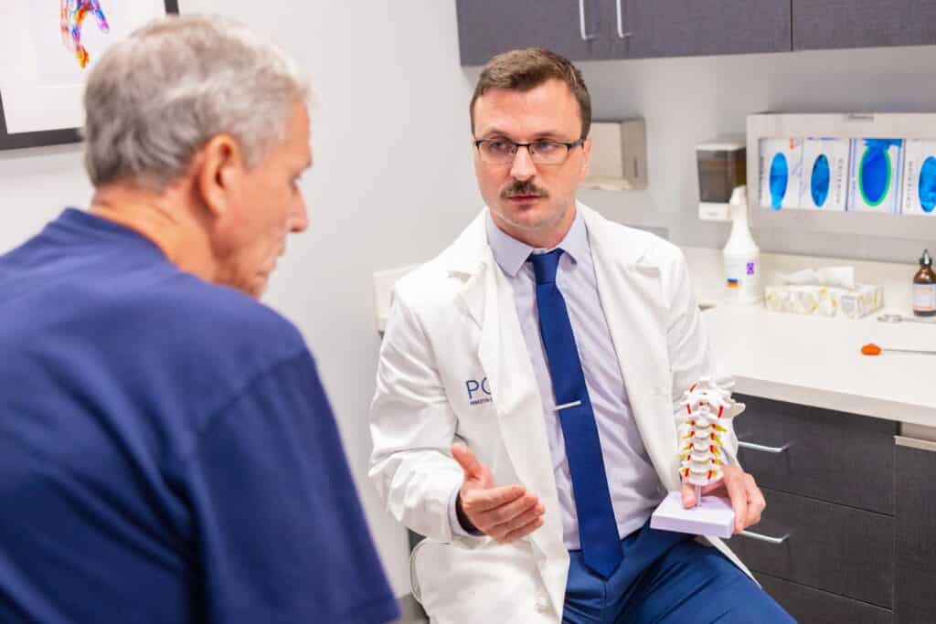 princeton orthopaedic associates new jersey orthopaedic surgeons 2023 - Princeton Orthopaedic Associates A POA physician talks with a patient about spine care