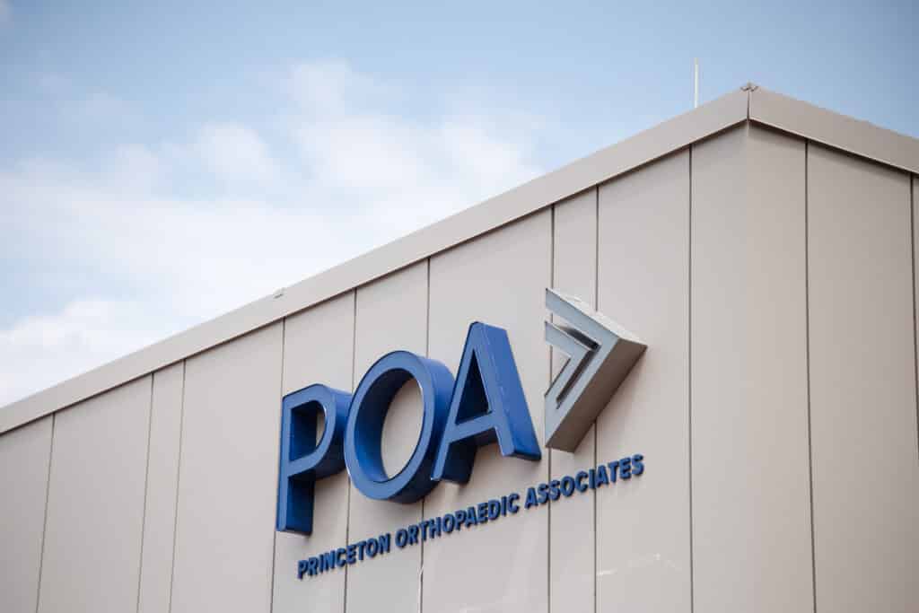 Blue lettering on the POA Surgery Center building